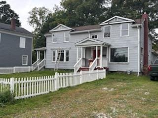 view of property with a front lawn