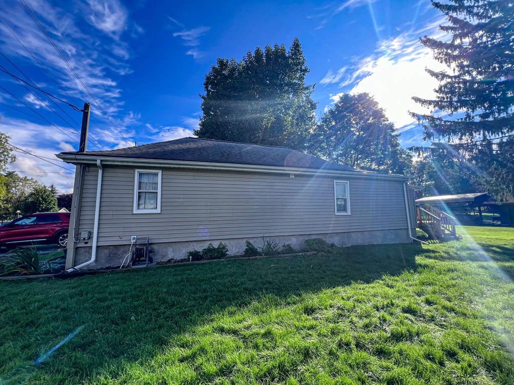 view of home's exterior featuring a yard