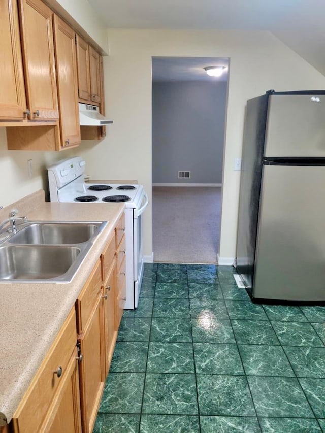 kitchen with sink, stainless steel fridge, and white range with electric stovetop