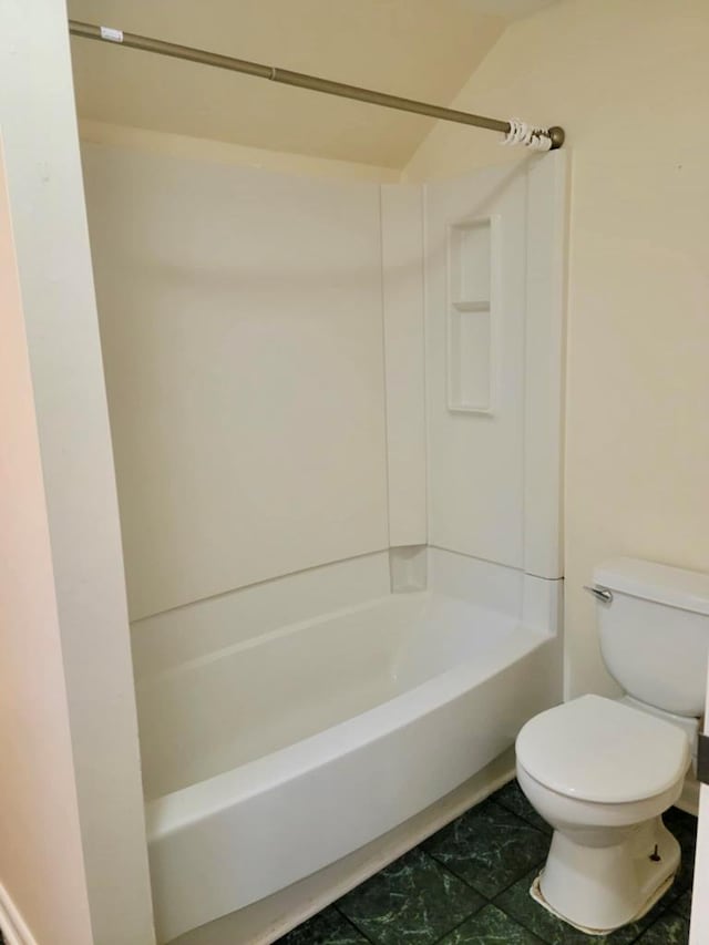 bathroom with shower / washtub combination and toilet