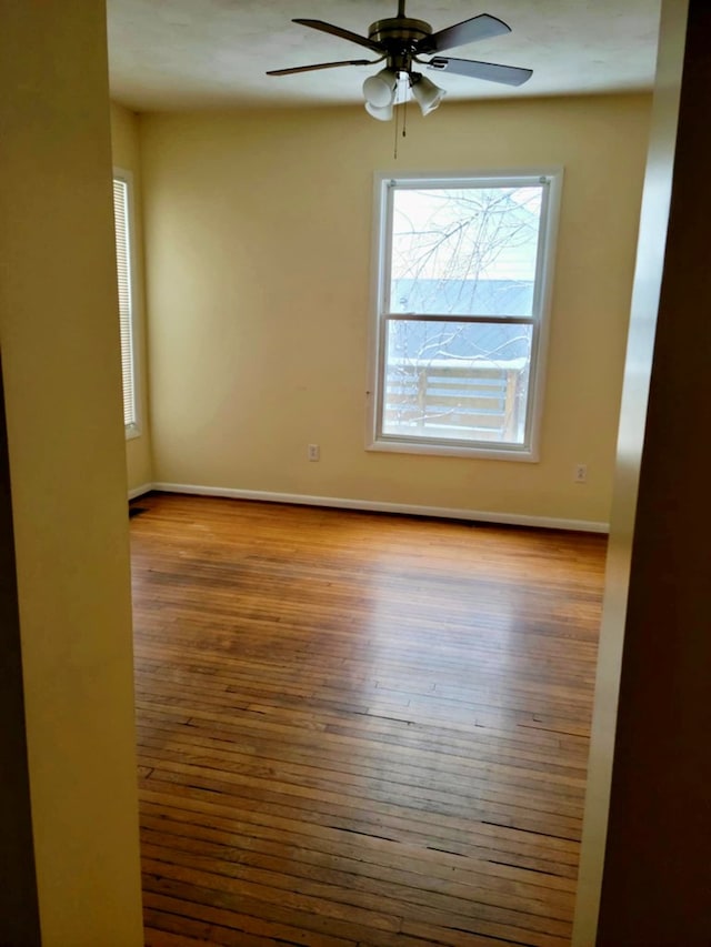 unfurnished room featuring ceiling fan and light hardwood / wood-style floors