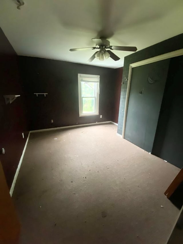 unfurnished bedroom featuring a closet and ceiling fan