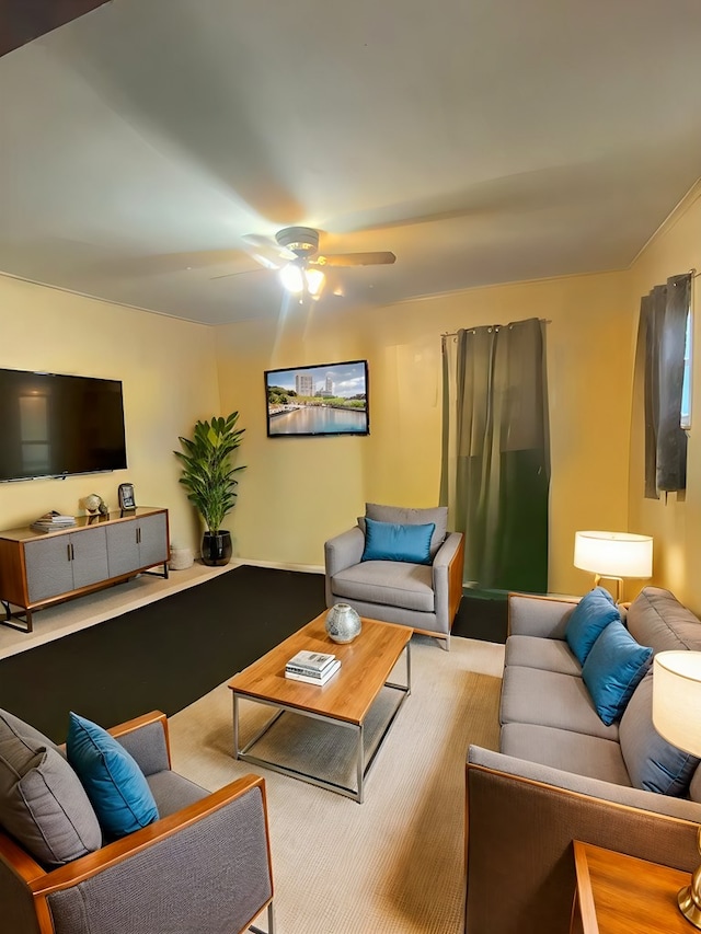 carpeted living room with ceiling fan