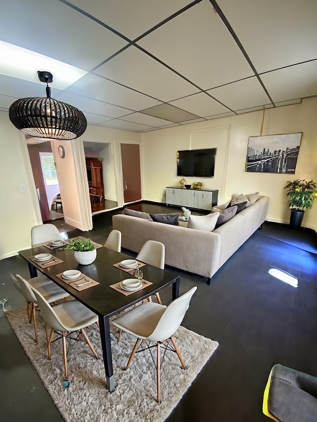 dining area with a drop ceiling