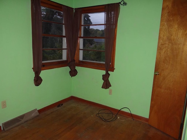 spare room with hardwood / wood-style flooring