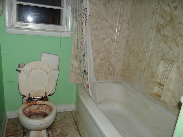 bathroom with shower / bathtub combination with curtain and toilet