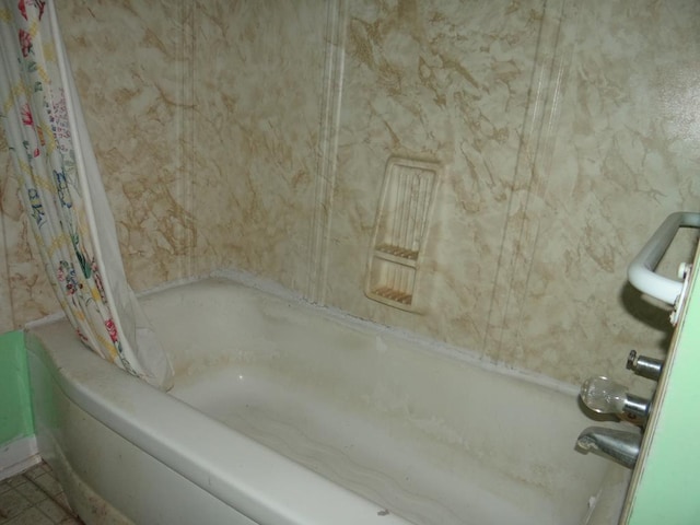 bathroom featuring shower / tub combo with curtain and tile patterned floors