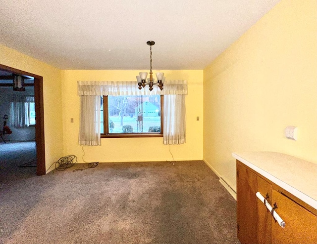 unfurnished dining area featuring carpet and an inviting chandelier