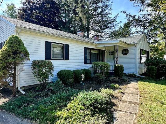 single story home featuring covered porch