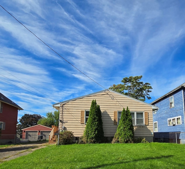 view of property exterior featuring a lawn