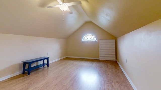 bonus room featuring light wood-type flooring, ceiling fan, and lofted ceiling