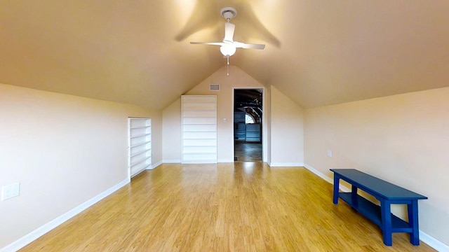 bonus room with ceiling fan, light hardwood / wood-style floors, and lofted ceiling