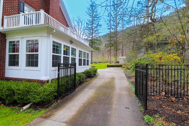 view of side of home with a balcony