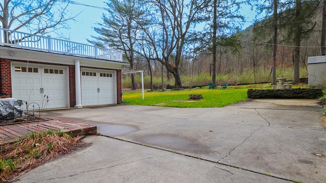 garage featuring a lawn