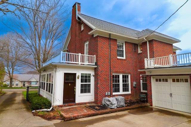 view of front of house with a balcony and a garage