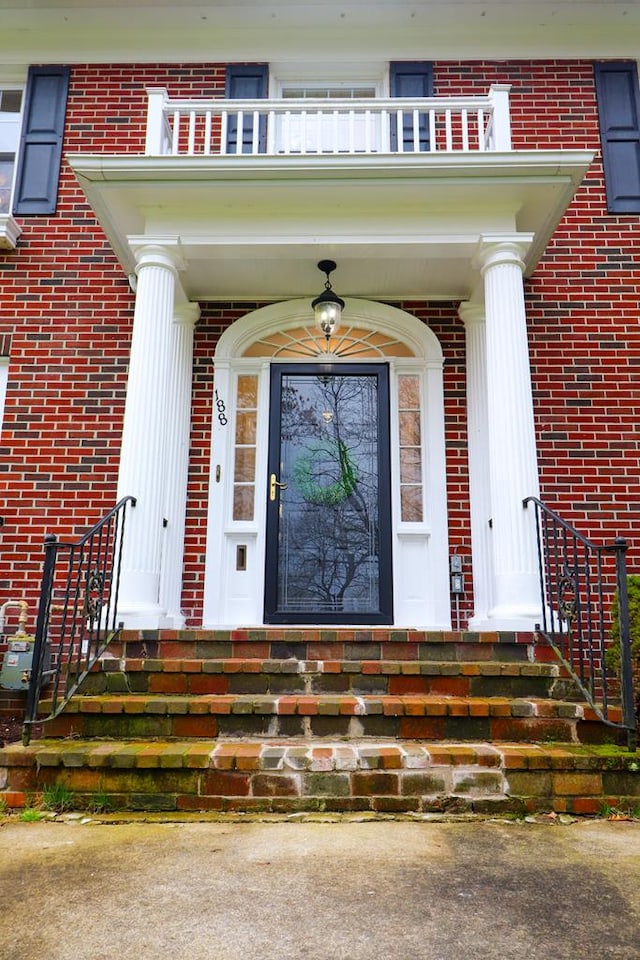 entrance to property featuring a balcony