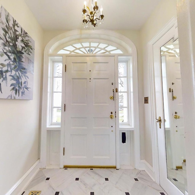 entrance foyer with an inviting chandelier