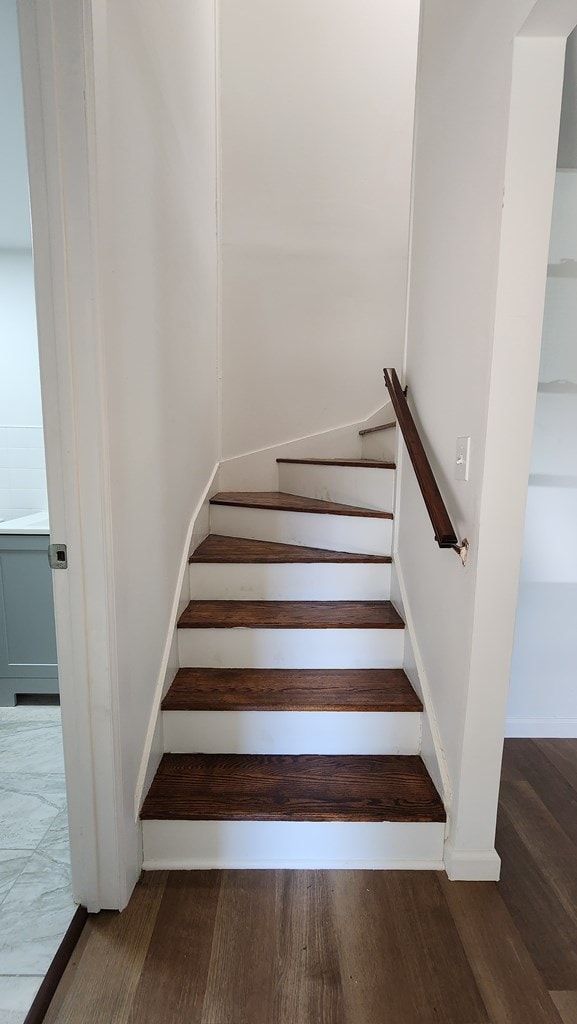 stairs with hardwood / wood-style floors