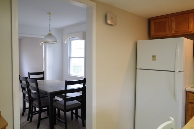 view of carpeted dining area