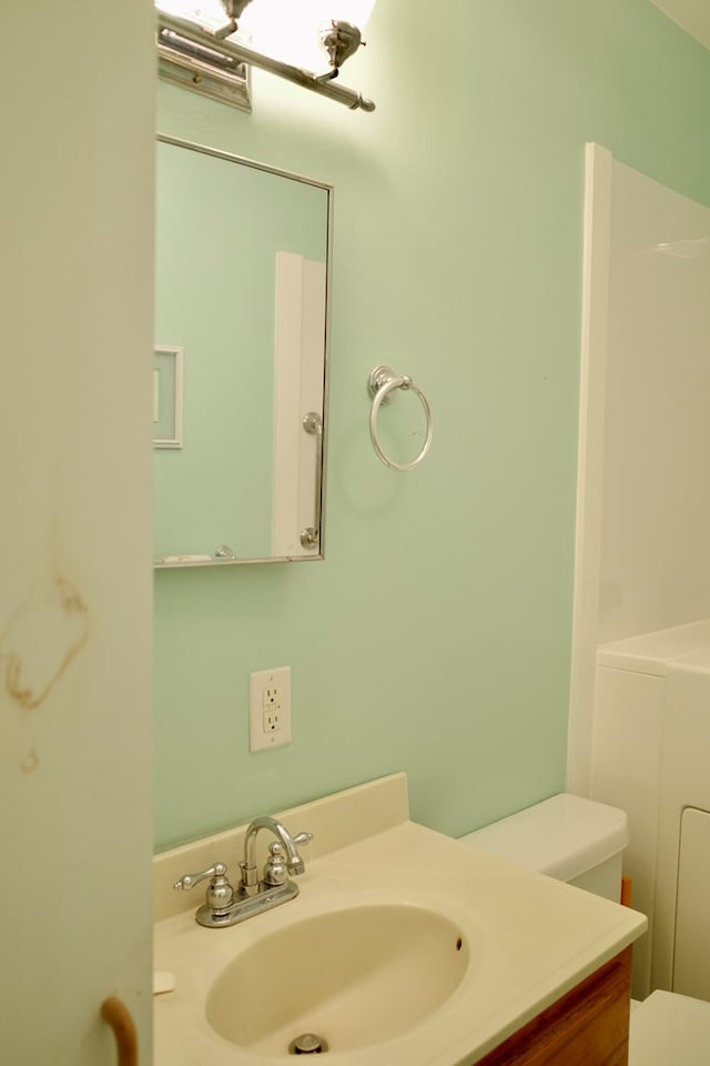 bathroom with vanity and toilet