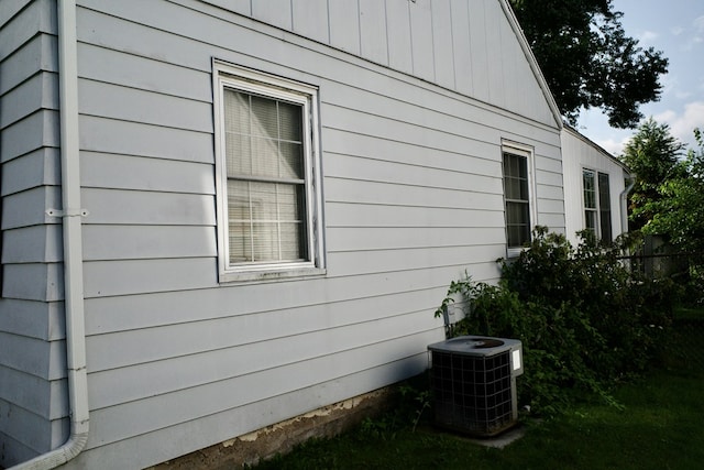 view of side of home featuring central AC