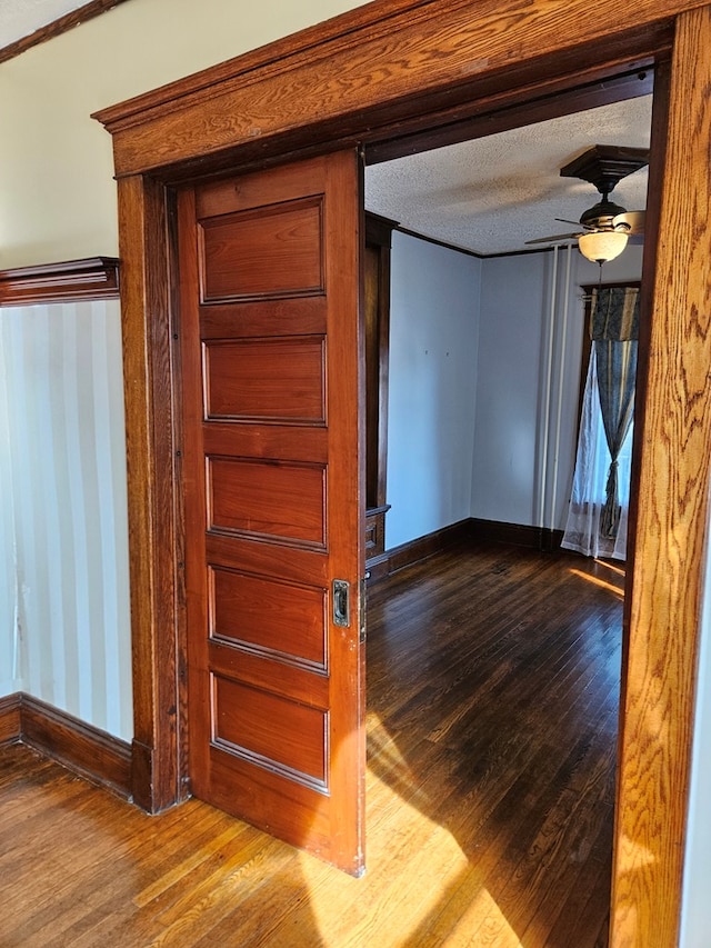 interior space featuring hardwood / wood-style floors and a textured ceiling