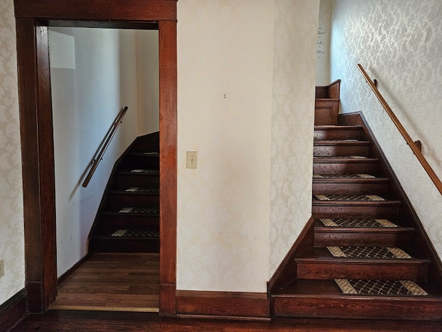 stairs featuring wood-type flooring