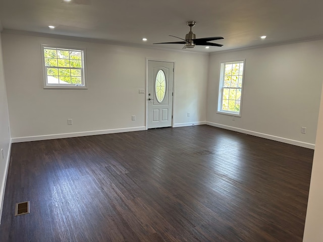 interior space with ceiling fan, dark hardwood / wood-style flooring, and crown molding