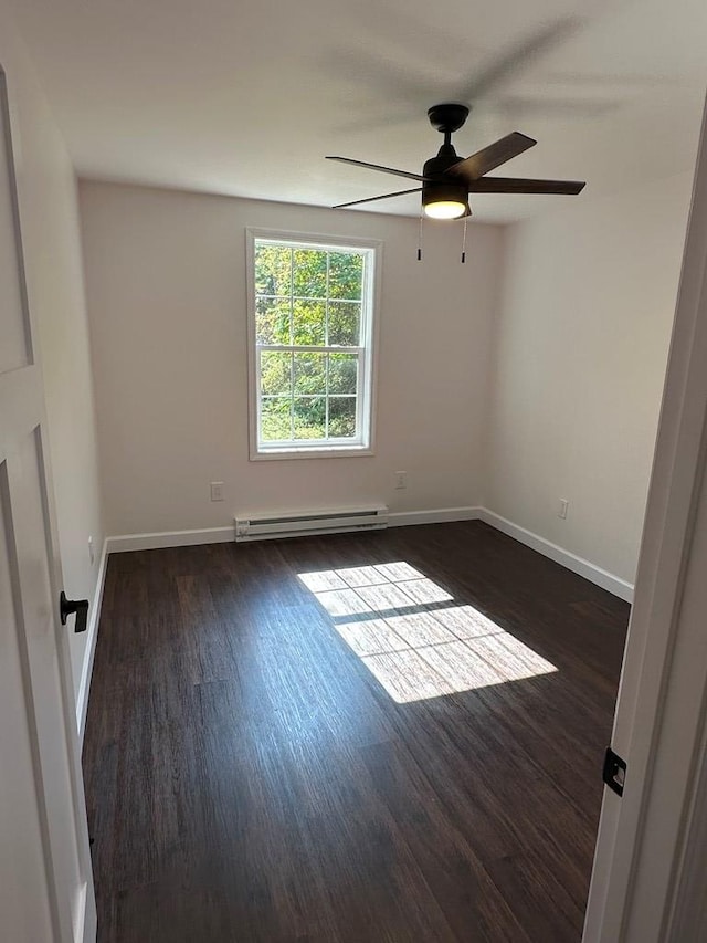 empty room featuring a baseboard radiator, dark hardwood / wood-style floors, and ceiling fan