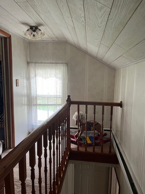 hall featuring lofted ceiling and a baseboard radiator