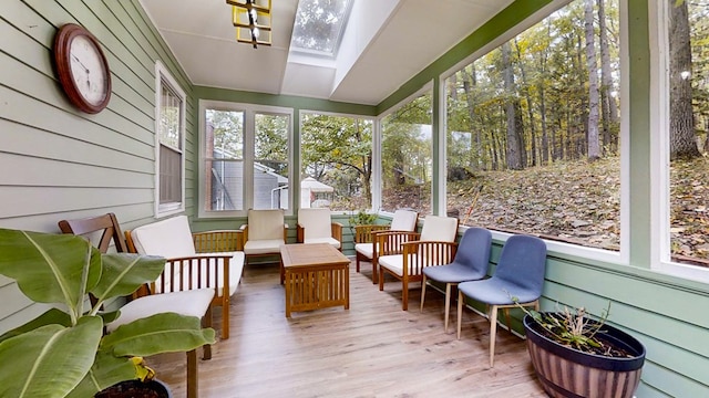 sunroom / solarium featuring a skylight