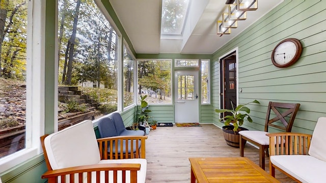 sunroom / solarium featuring a skylight