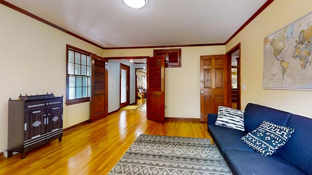 living room featuring hardwood / wood-style flooring and ornamental molding