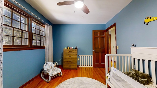 bedroom featuring ceiling fan and light hardwood / wood-style floors