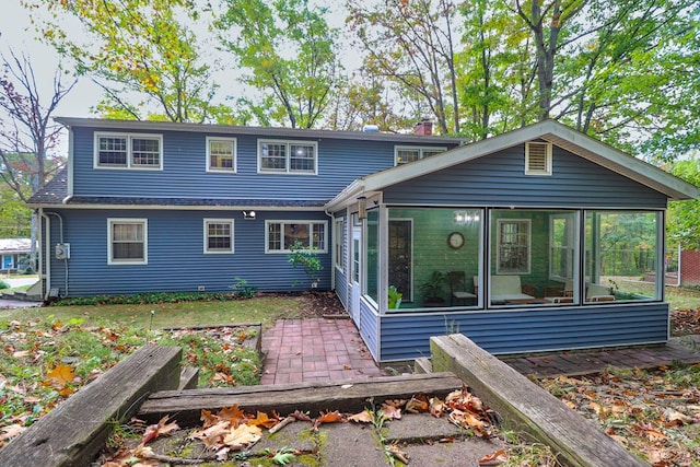 view of front of home featuring a sunroom