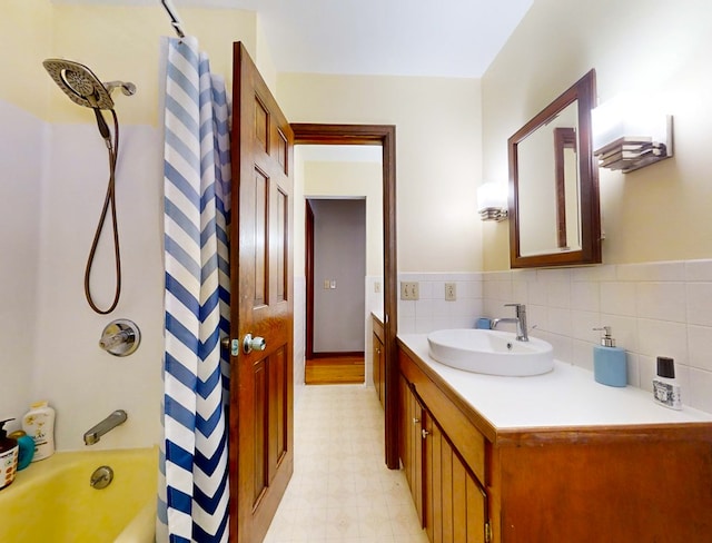 bathroom featuring shower / bath combination with curtain and vanity