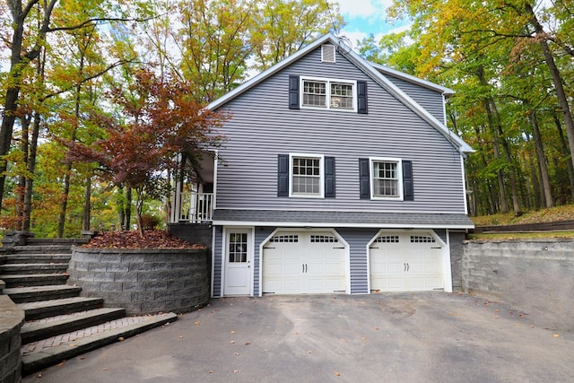 view of side of property featuring a garage