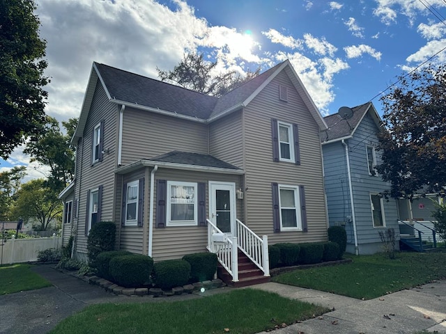 front facade featuring a front lawn