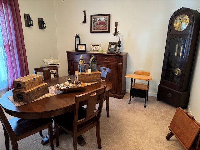 dining room featuring light colored carpet