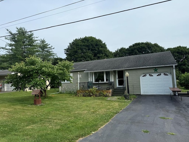 view of front of property with a garage and a front lawn