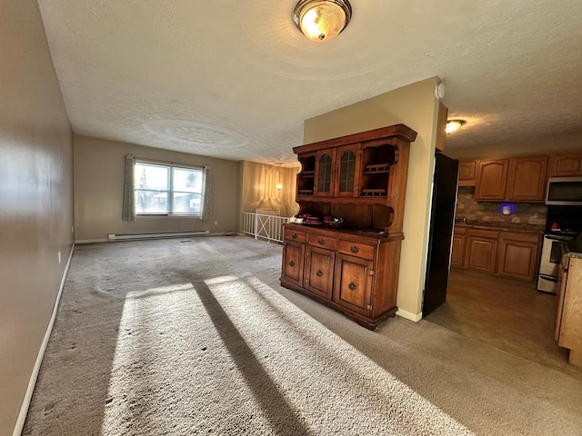 interior space featuring a textured ceiling and a baseboard heating unit