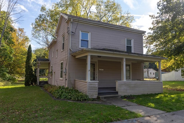 view of front of home with a front yard and a porch