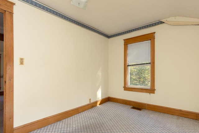 empty room with carpet flooring