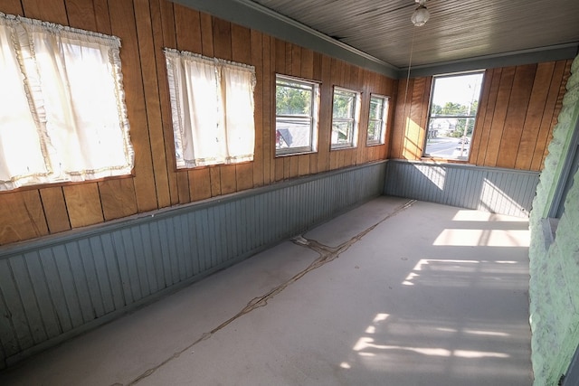 unfurnished sunroom featuring a wealth of natural light