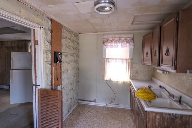 kitchen with white fridge and sink