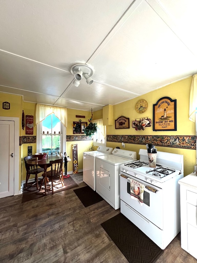 kitchen featuring washer / dryer, gas range gas stove, and dark hardwood / wood-style flooring