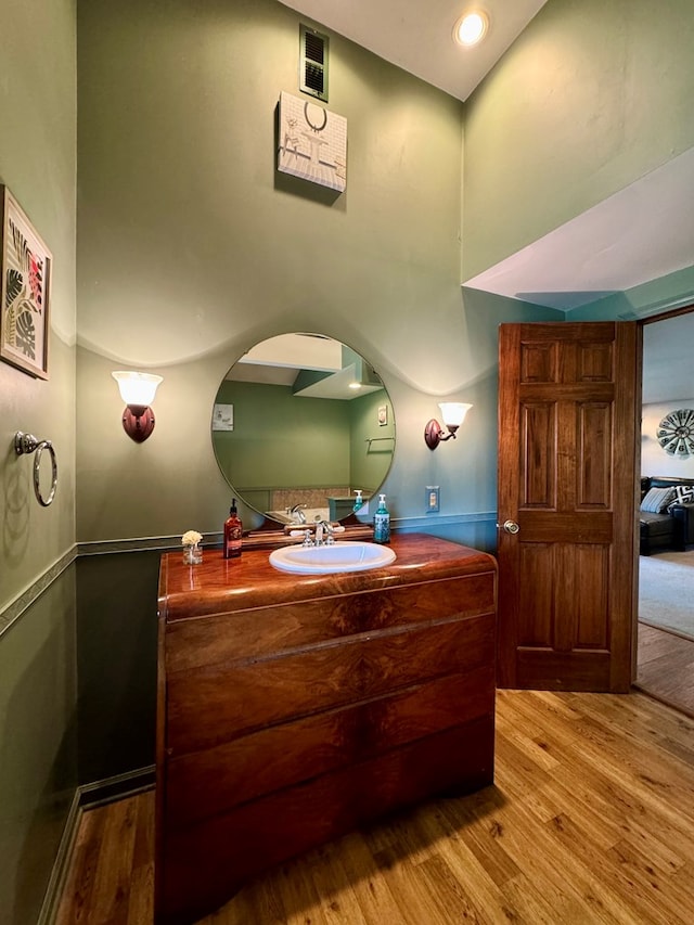 bathroom featuring vanity and hardwood / wood-style flooring