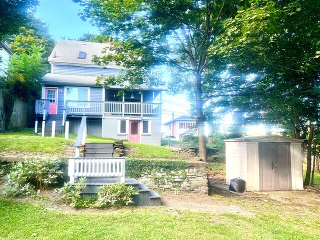 exterior space with a storage shed and a lawn