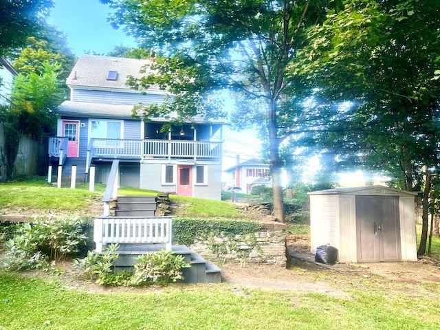 exterior space with a wooden deck, a yard, and a shed