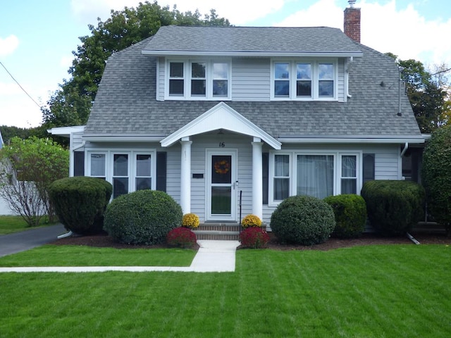 view of front of home with a front yard